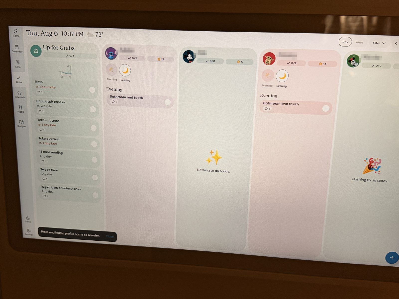Skylight Calendar chores view with a column per family member and a shared Up for Grabs list
